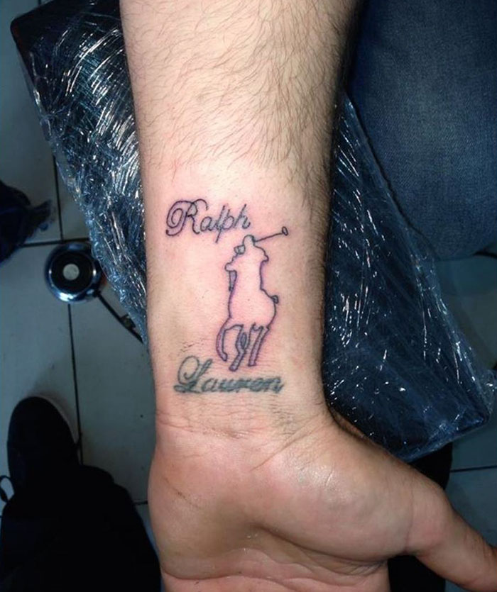 Arm displaying a creative cover-up tattoo with a stylized horse and rider logo.