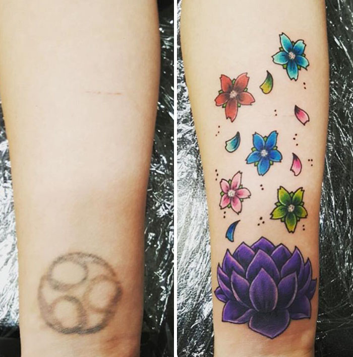 Cover-up tattoo transforming faded design into vibrant flowers and a lotus.