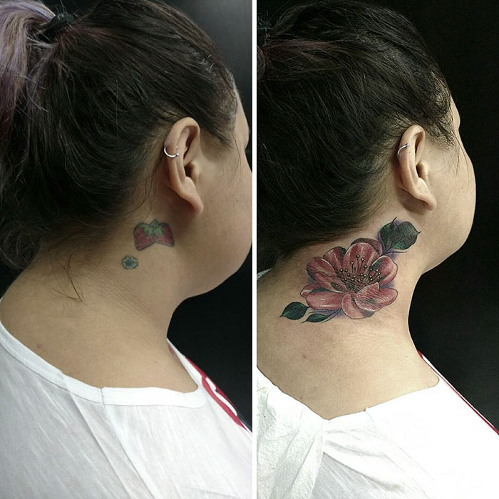 Neck cover-up tattoo: old small design replaced by a vibrant pink flower.
