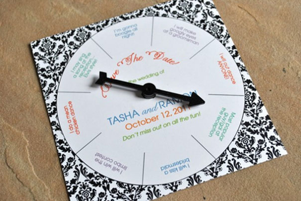 Creative wedding invitation featuring a spin-the-wheel design with RSVP details on patterned background.
