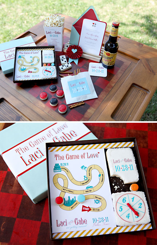 Creative wedding invitations displayed on a table featuring a game-themed design with personalized details and treats.