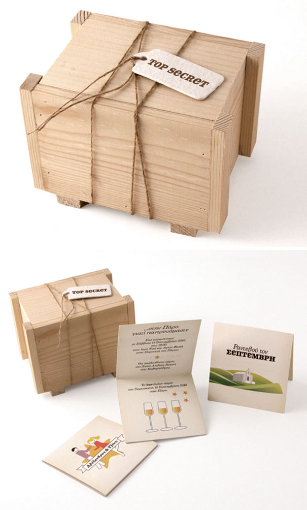Wooden box with creative wedding invitations inside, tied with string and labeled top secret for unique presentation.