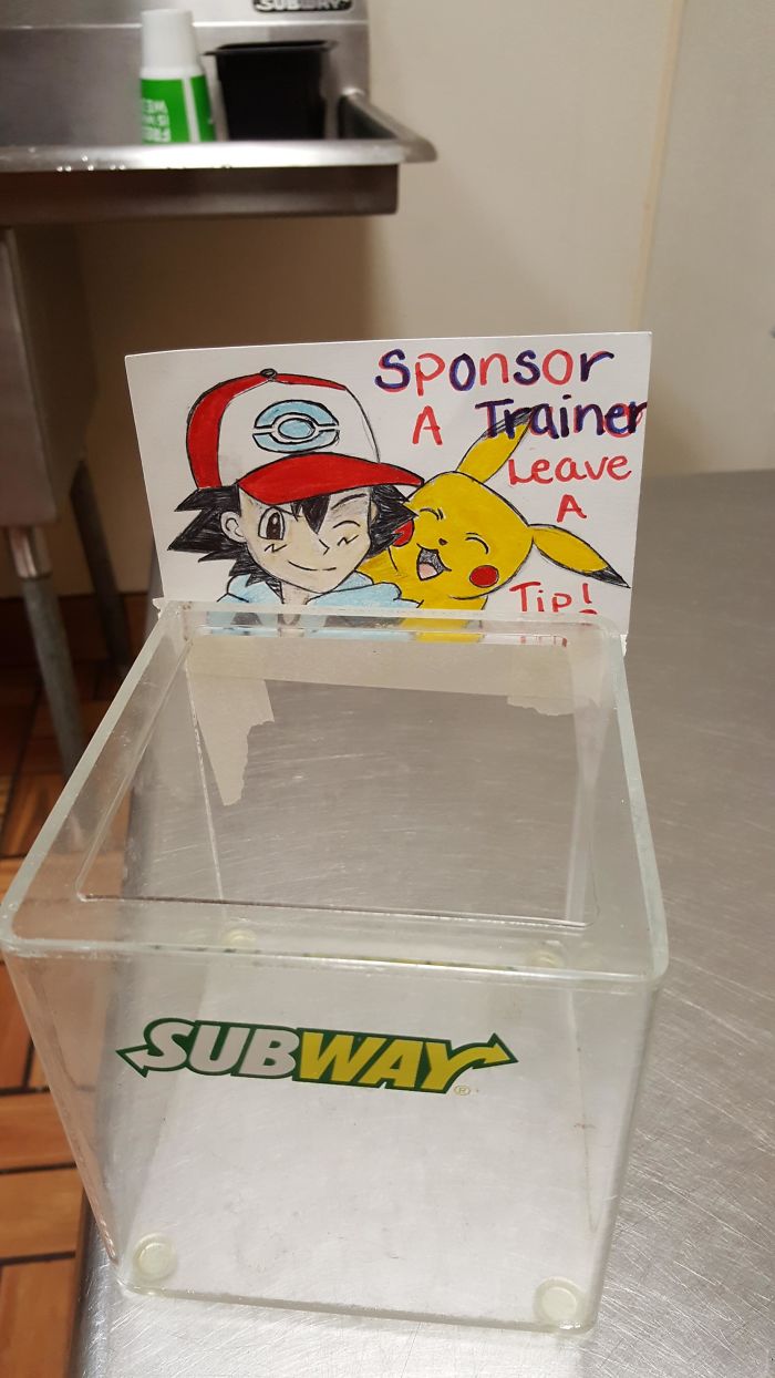 Subway tip jar with Pokemon Go-themed sign featuring cartoon characters.