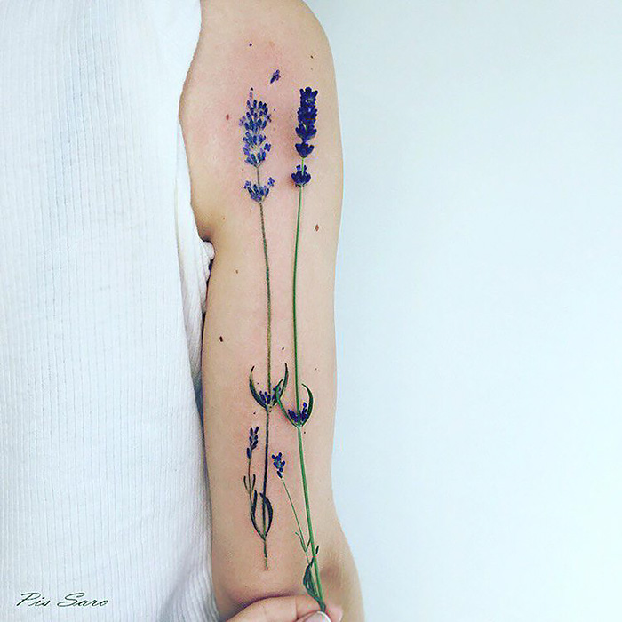 Ethereal nature tattoo of lavender sprigs on an arm, inspired by changing seasons.