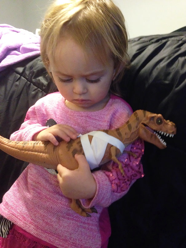 Here's My 2-Year-Old, Who Asked Me To Help Treat This Dinosaur's Wounds, And Now Comforting Him