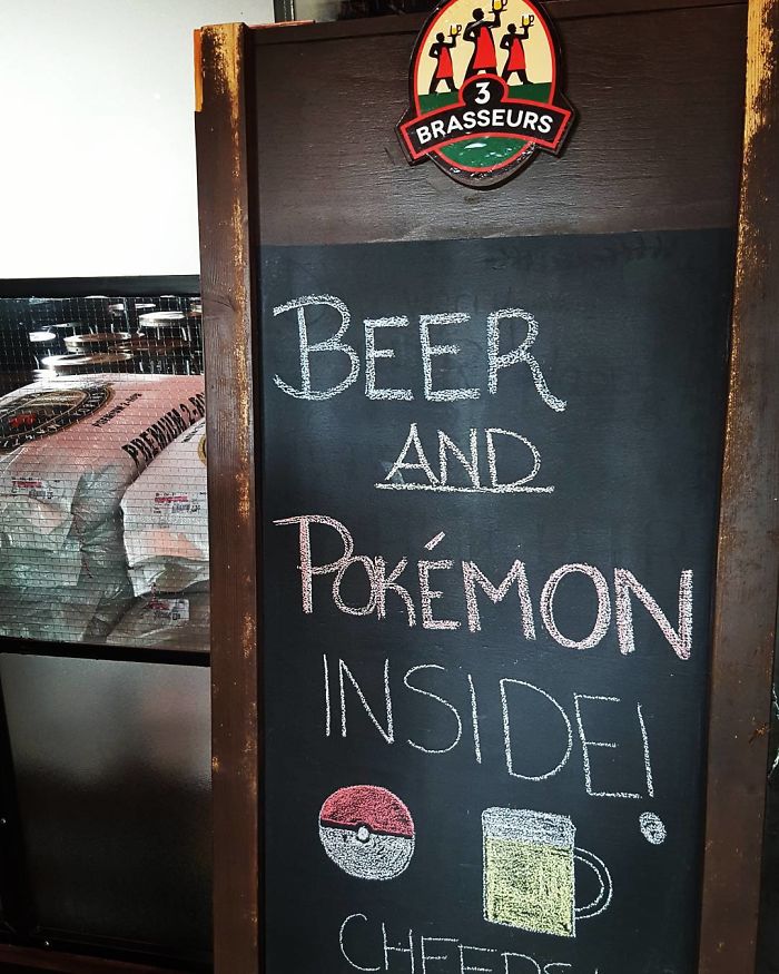 Chalkboard sign at 3 Brasseurs inviting people for beer and Pokémon inside.