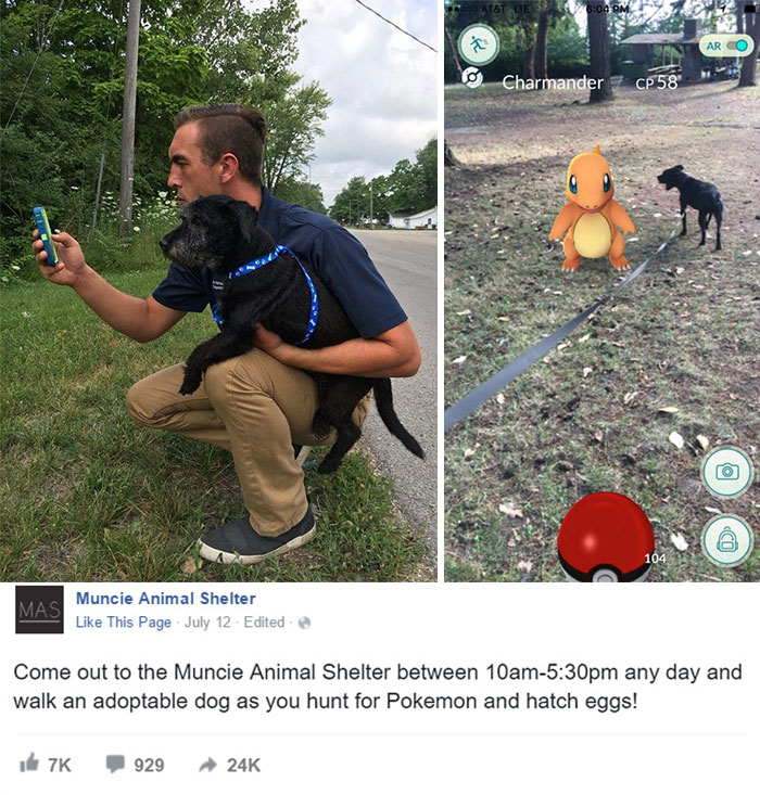 Man with a black dog playing Pokemon Go; Charmander appears next to the dog on the app.