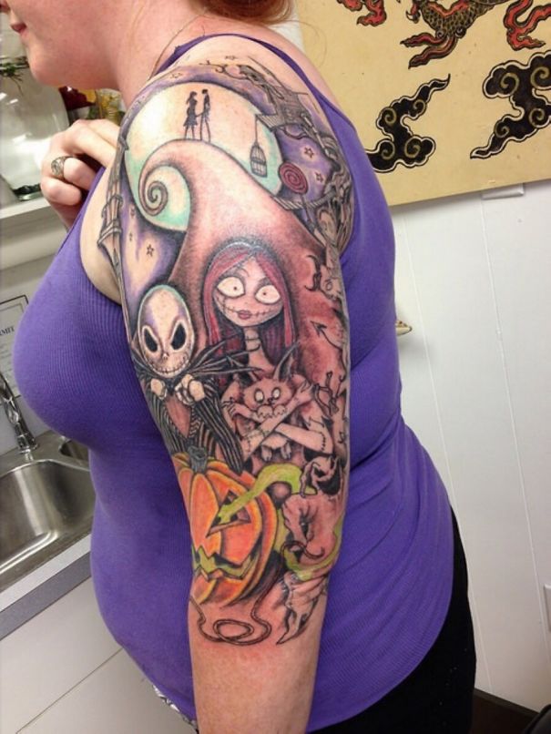 Colorful Pixar-inspired tattoo sleeve featuring Halloween-themed characters.