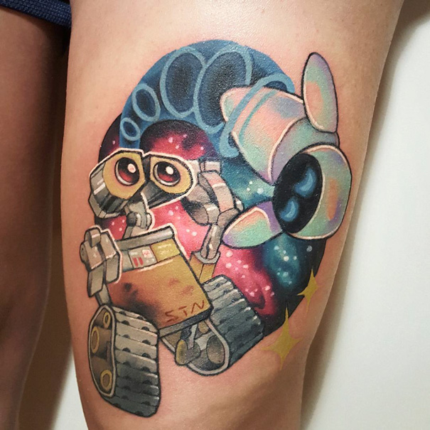 Pixar-inspired tattoo featuring a colorful design of two robots against a cosmic background.