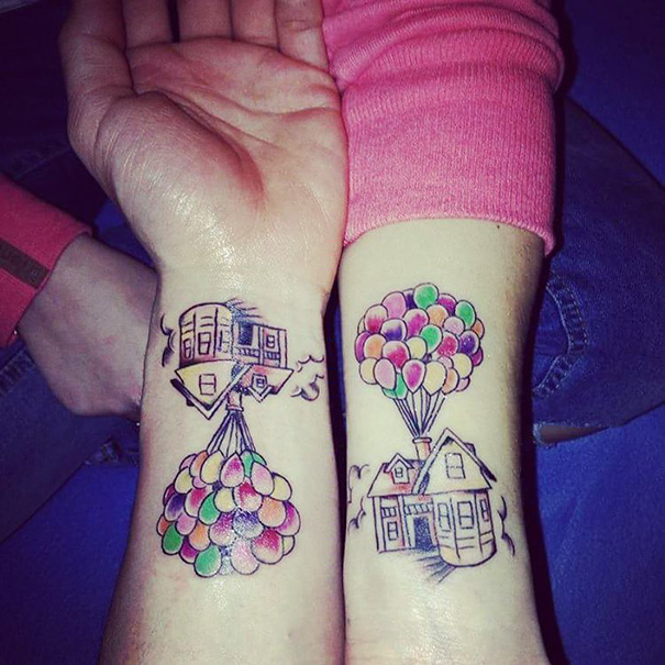 Pixar-inspired wrist tattoos featuring a house lifted by colorful balloons, symbolizing adventure and imagination.