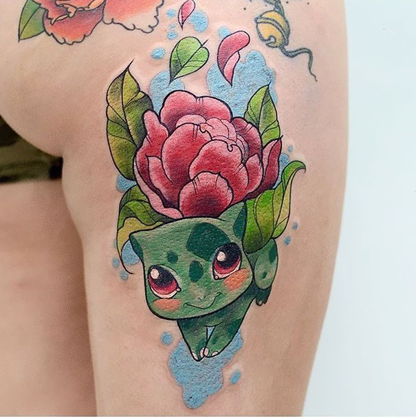 Colorful Pokemon tattoo of Bulbasaur with a flower design.
