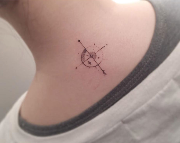 Minimalist tattoo on neck featuring geometric design by Korean artist.