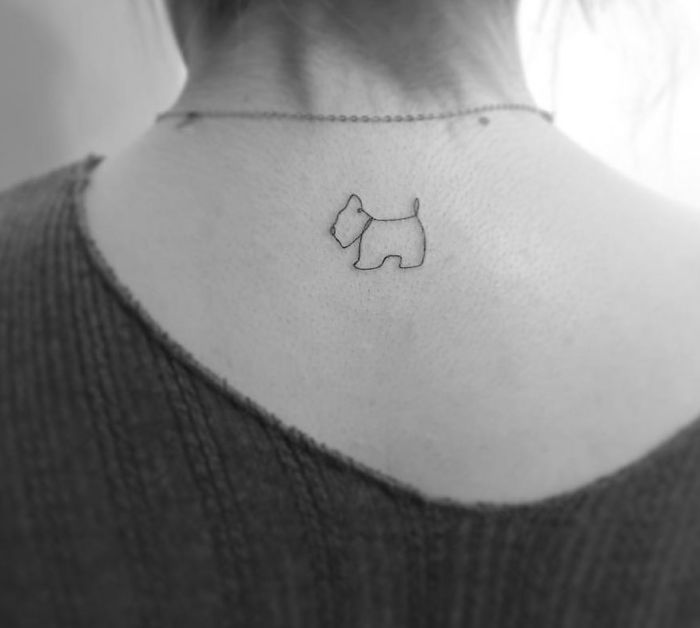 Minimalist tattoo of a small dog on the neck by a Korean artist.