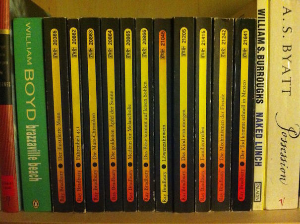 Bookshelf misaligned with Bradbury titles arranged incorrectly; one job fail.