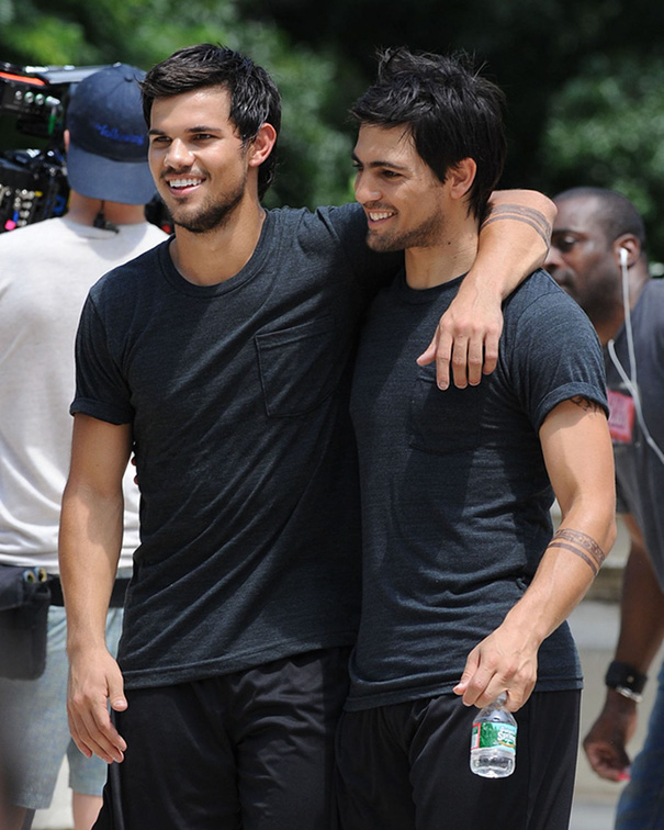 Two men in matching dark shirts posing together outdoors, illustrating celebrities body doubles in Hollywood settings.