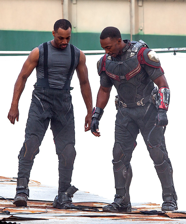 Two men wearing tactical suits on a film set, illustrating Hollywood celebrities’ body doubles in action.