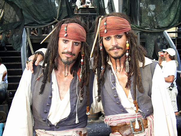 Two men dressed as pirates with similar costumes and makeup, illustrating celebrities’ body doubles in Hollywood.