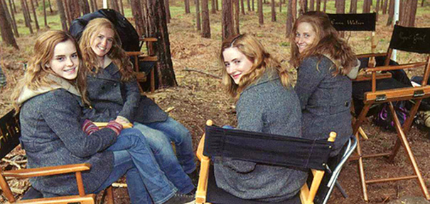 Four women sitting on director chairs in a forest setting, illustrating Hollywood celebrities’ body doubles on set.