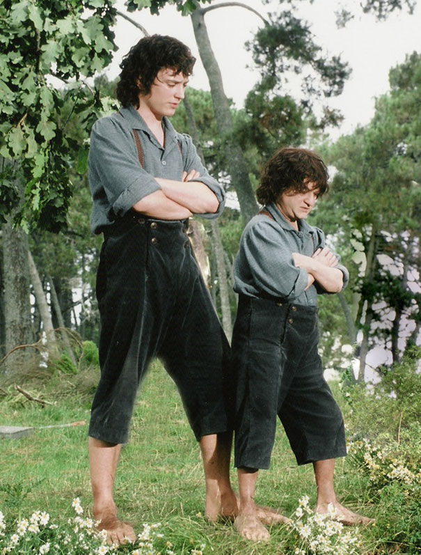 Two actors dressed as hobbits in nature, showcasing Hollywood celebrities body doubles on set.