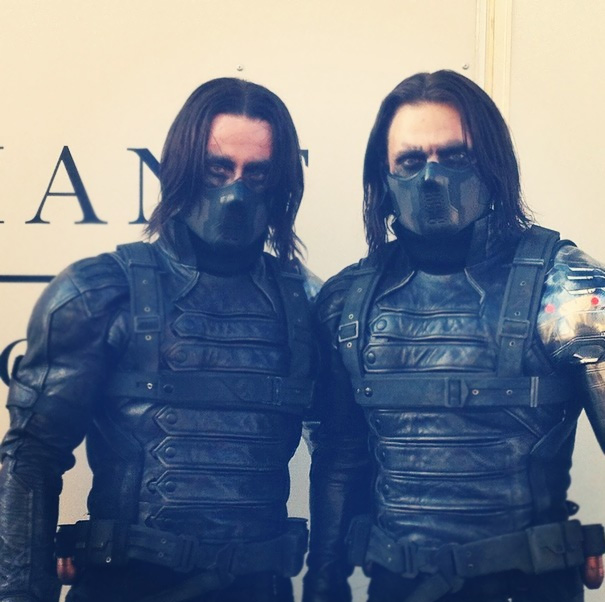 Two men dressed as a celebrity’s body double in black tactical gear and masks for Hollywood stunt scenes.
