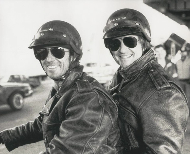 Black and white photo of two men in helmets and leather jackets, showcasing Hollywood celebrities’ body doubles.