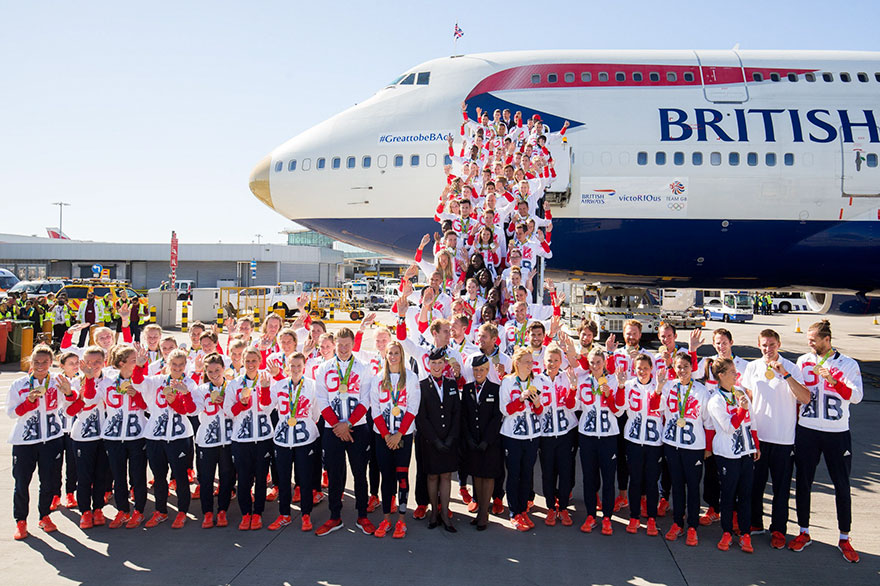 british-olympic-athletes-red-bags-heathrow-airport-2 british-olympic-athletes-red-bags-heathrow-airport-2