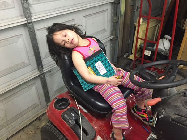 Napping On The Riding Lawn Mover. Amazing That She Can Still Hold On To Her Book And Crayons