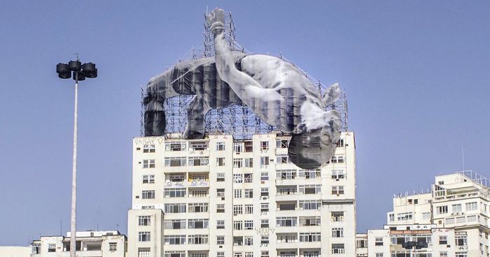 French Artist JR Installs Giant Athletes Across Rio’s Urban Landscape For 2016 Olympic Games