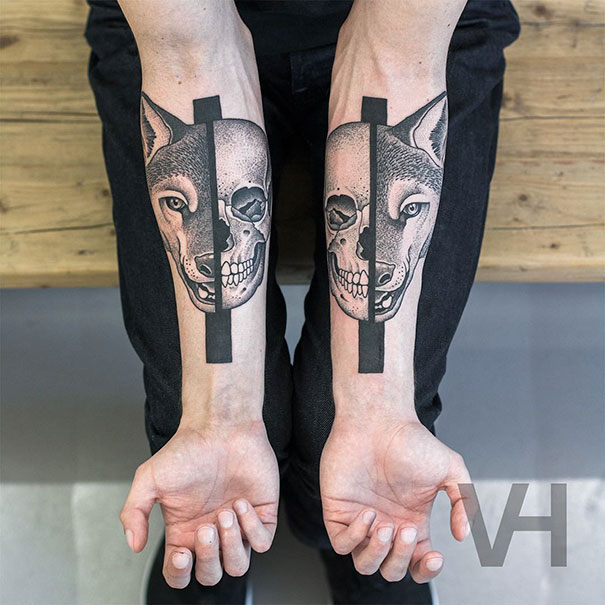Symmetrical tattoos on forearms blend nature and geometry with wolf and skull designs by Valentin Hirsch.