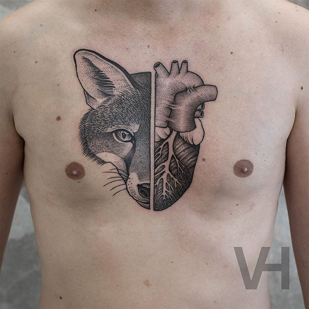 Symmetrical tattoo featuring a fox and human heart by Valentin Hirsch, blending nature and geometry on the chest.