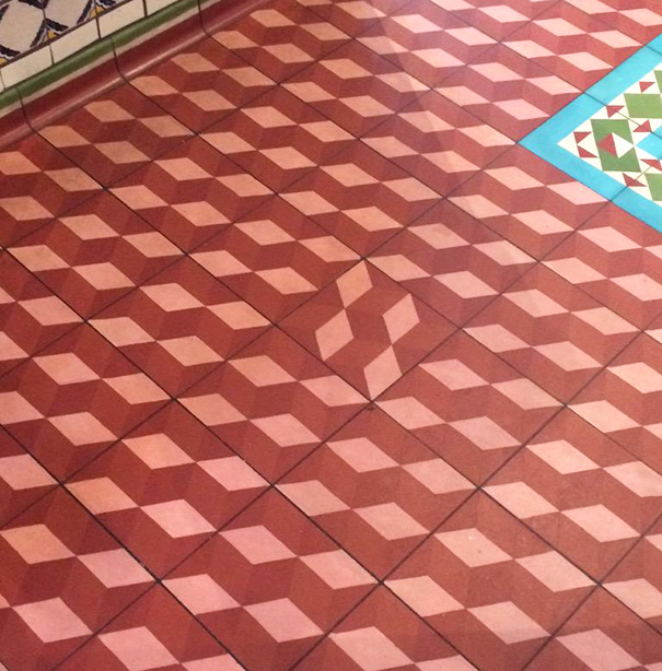 Patterned floor tiles misaligned; visual example of a failed job e*******n.