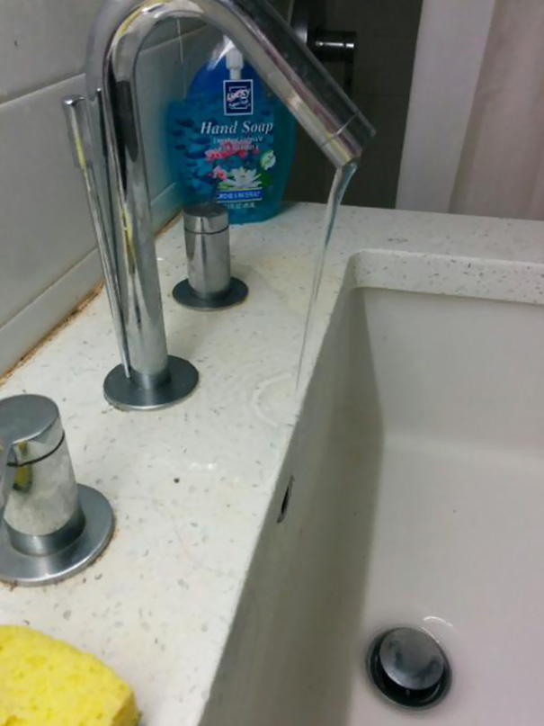 Sink faucet misaligned with the basin, a classic one job fail.