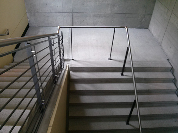 Staircase with misaligned railings showcasing a job fail.