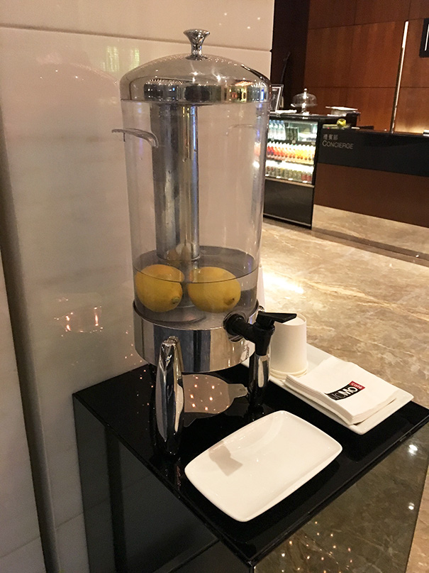 Water dispenser with lemons inside, failing at providing flavor, highlighting a humorous job fail.