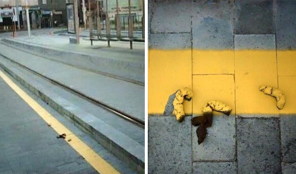 Failed job example: a yellow line painted over debris on a sidewalk and tram track.