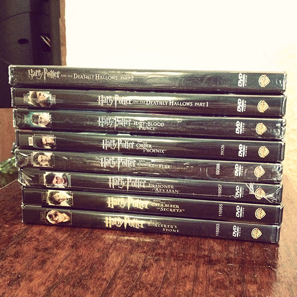 Stack of Harry Potter DVDs with incorrect order in a display showcasing a job fail.