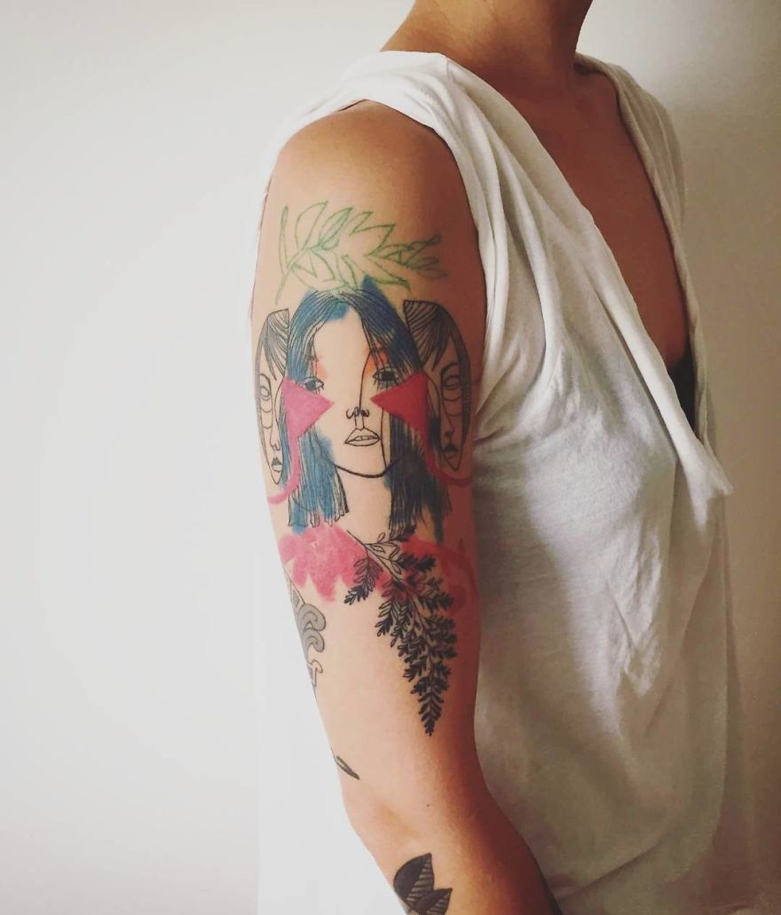 Arm displaying a colorful and sketchy tattoo of a woman’s face and floral designs, styled by Vesna.