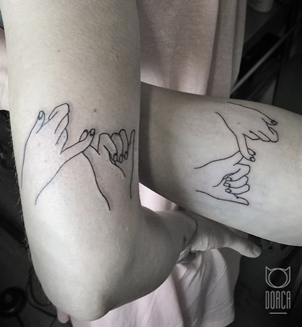 Three matching outline tattoos of hands making pinky promises on different people’s arms.