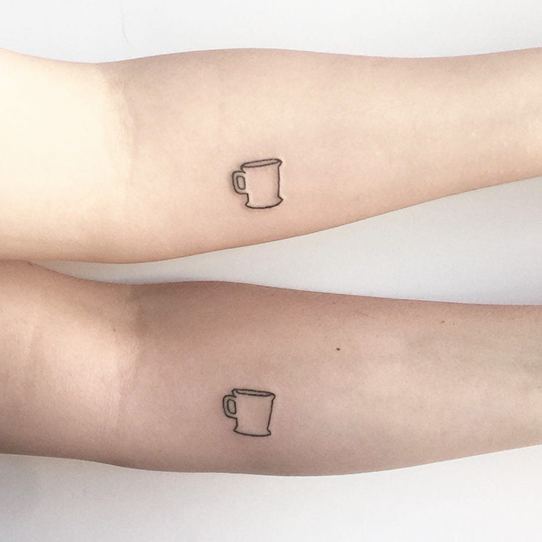 Minimalist trio tattoos of coffee mugs on forearms, showcasing unique matching designs.