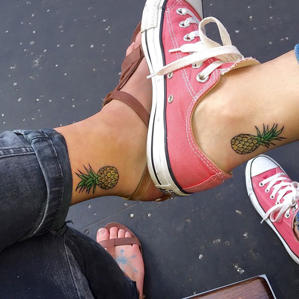 Three matching pineapple tattoos on ankles, symbolizing trio tattoo ideas with vibrant, fun designs.