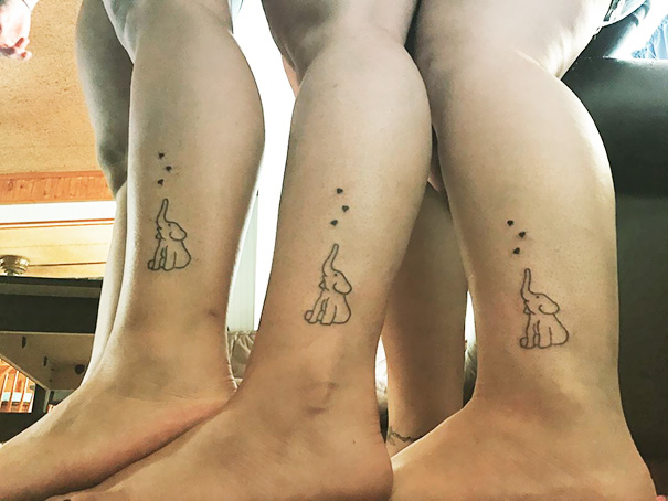 Three matching elephant trio tattoos on ankles, symbolizing unity and friendship.
