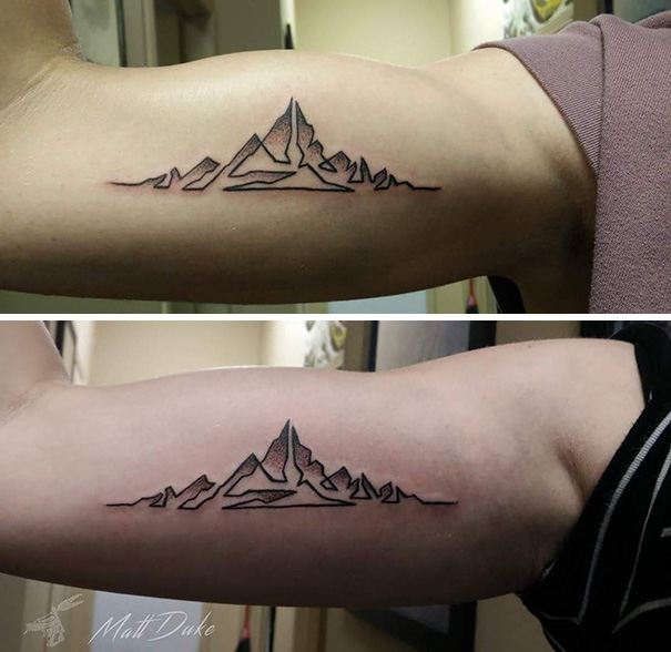 Mountain trio tattoos on inner arms, showcasing minimalist design.