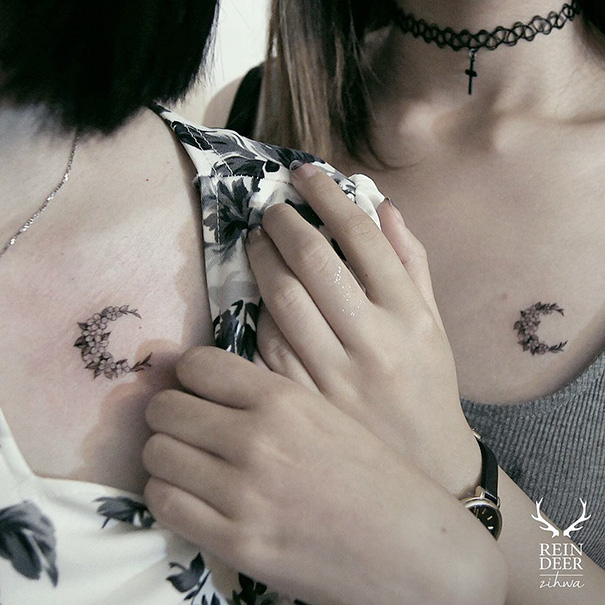 Two individuals showcasing crescent moon trio tattoos on their chests, symbolizing unique connections and unity.