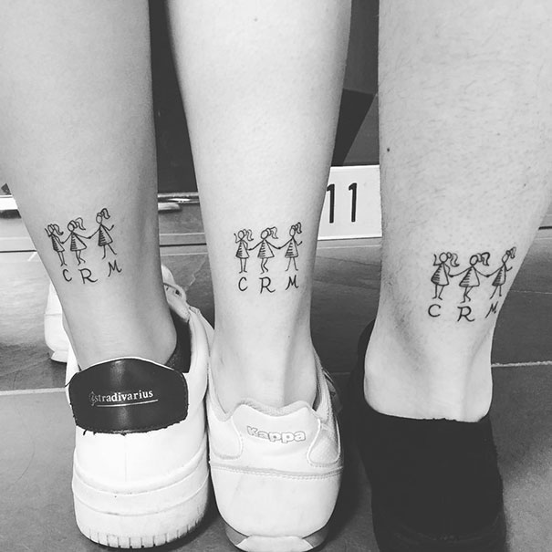 Trio tattoos on legs with stick figure designs and initials, displaying friendship and unity.
