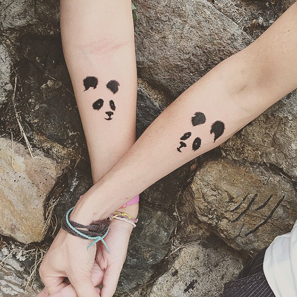 Trio tattoos of panda faces on two arms, symbolizing unity and friendship in a creative design.