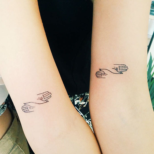 Trio hand tattoos on two arms, showcasing minimalist design and creativity.