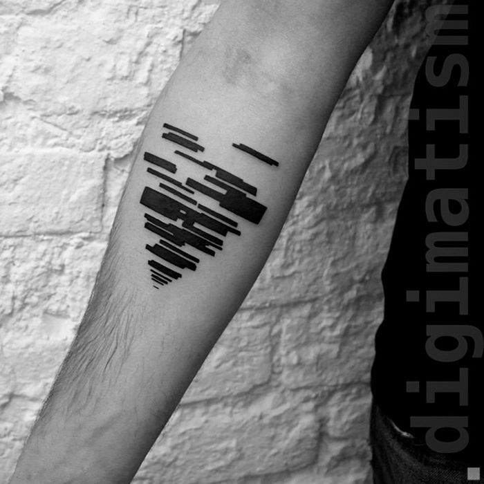 Minimalist digitally-designed tattoo on a person's arm, featuring geometric shapes against a brick wall background.
