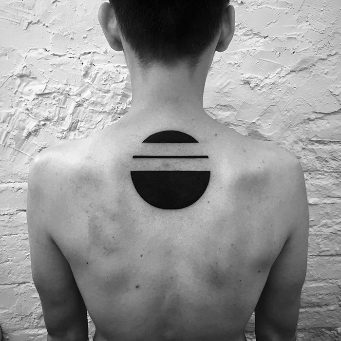 Minimalist digitally-designed back tattoo with geometric shapes by Russian artist.