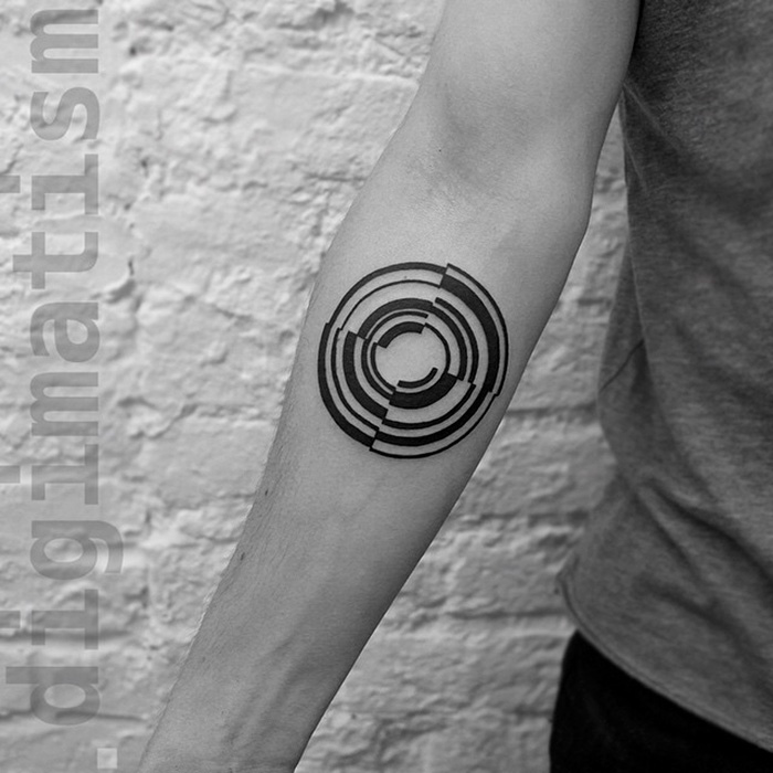 Minimalist digitally-designed tattoo of circular shapes on a person's forearm, created by a Russian artist.