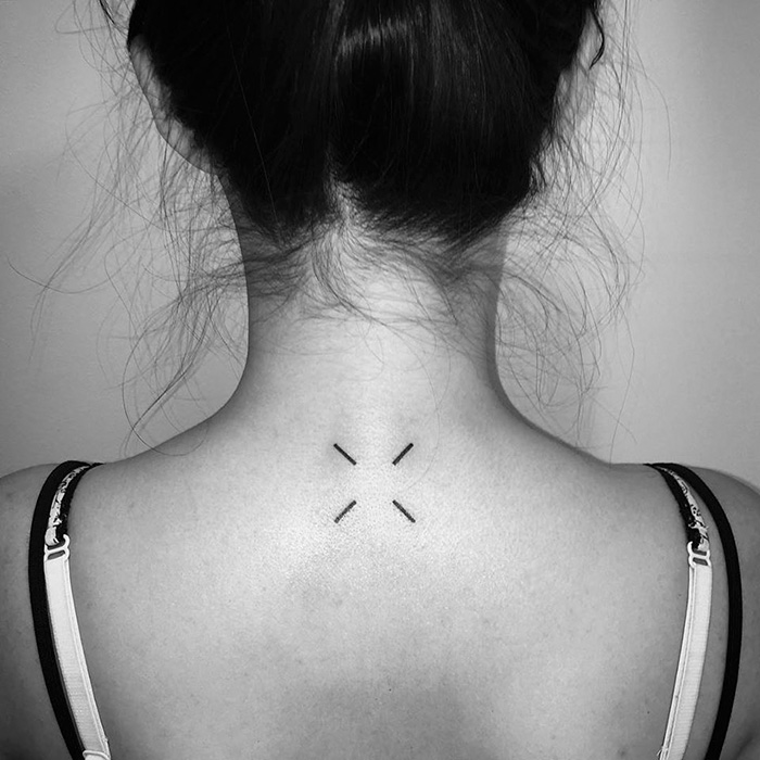 Minimalist tattoo design with four lines on a woman's upper back, created by a Russian artist.